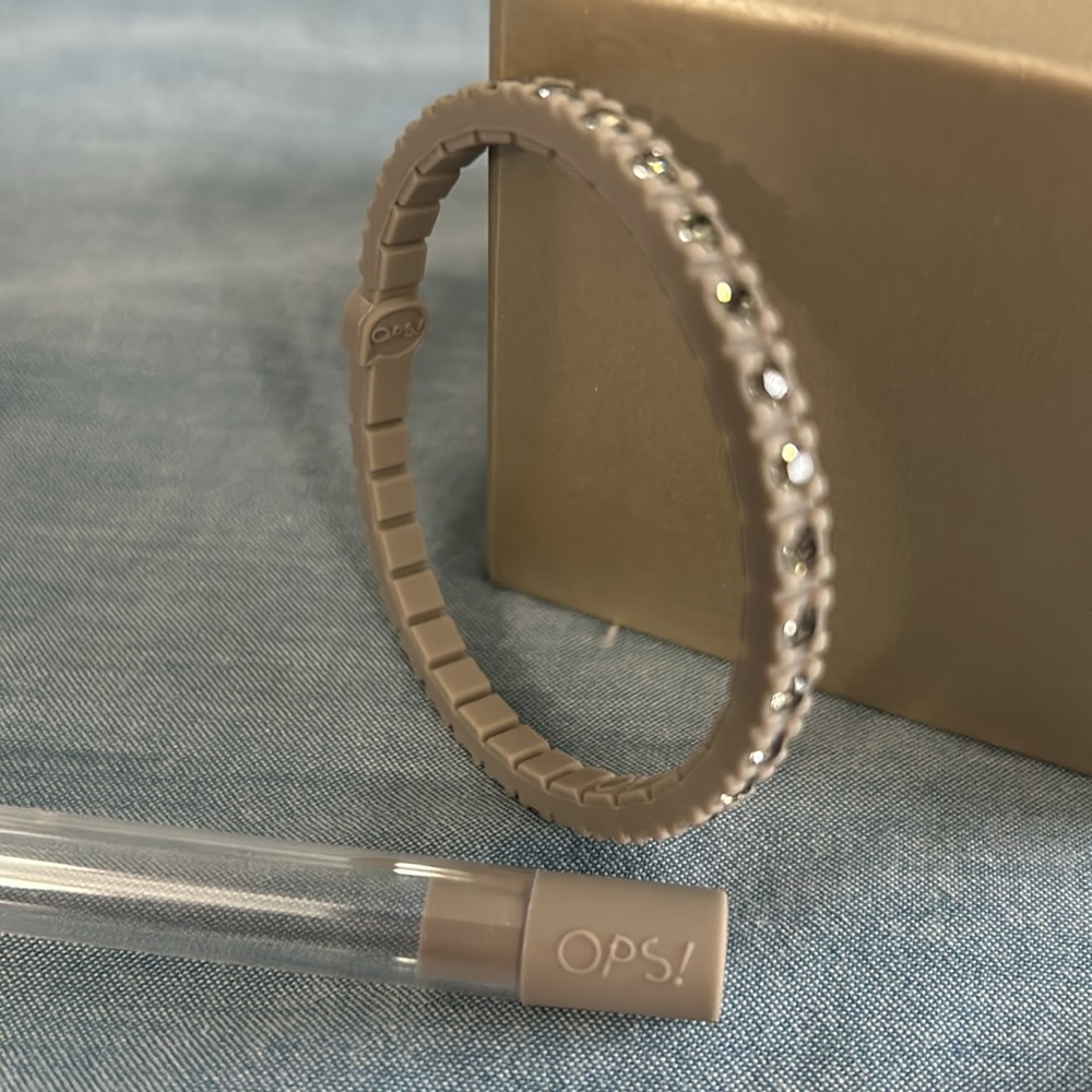 OPS silicone tennis bracelet gray with Swarovski crystals. New in original case